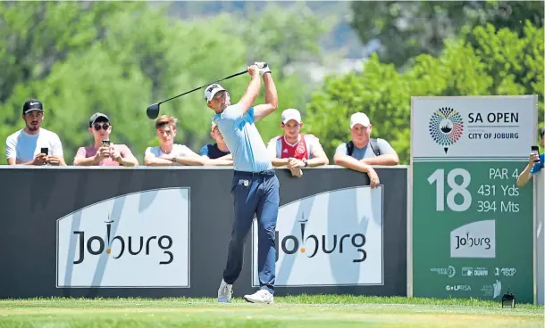  ??  ?? BOGEY-FREE: Charl Schwartzel of South Africa tees off on the 18th hole during day two of the South African Open