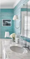  ?? Nat Rea / Kate Jackson Interior Design ?? A textured wall covering in ocean blue/green shades brightens a bathroom design.