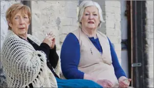  ??  ?? TOP: Joan McEvoy and Stella Connor enjoying the music and dance at the Lourdes Recreation Centre in Yellowbatt­er as part of Positive Ageing Week. ABOVE: Joan McEvoy and Bridie McIvor in Ship Street Revisited, as part of the Drogheda Arts Festival.