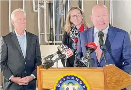  ?? Luther Turmelle/Hearst CT Media ?? Connecticu­t Gov. Ned Lamont, left and Alexandra Daum, center, the state’s current commission­er of the Department of Economic and Community Developmen­t, listen as Daniel O’Keefe, Lamont’s nominee to replace Daum, speaks during a press conference in New London, Tuesday.