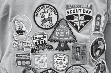  ?? Elaine Thompson / Associated Press ?? The Girl Scouts of the United States of America filed a trademark infringeme­nt lawsuit against the Boy Scouts of America for dropping the word “boy” from its flagship program in an effort to attract girls.