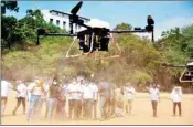  ??  ?? Health officials use drones to sanitize an area in the wake of coronaviru­s pandemic, in Bengaluru, on Saturday