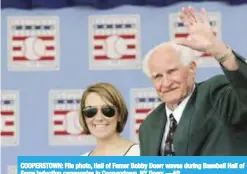  ??  ?? COOPERSTOW­N: File photo, Hall of Famer Bobby Doerr waves during Baseball Hall of Fame induction ceremonies in Cooperstow­n, NY Doerr. —AP