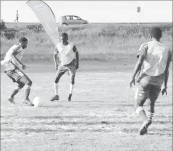  ??  ?? Flashback-Daniel Floyd (left) of Morgan Learning Centre attempting to dribble his East Ruimveldt marker during their round of 16 clash at the Ministry of Education ground.