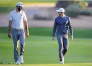  ?? KAMRAN JEBREILI/ASSOCIATED PRESS FILE ?? Dustin Johnson, left, and Rory McIlroy, shown in this Jan. 18, 2018, photo, will be teammates in a Sunday charity match that marks golf’s return to live TV.