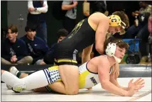  ?? JASON SCHMITT — FOR MEDIANEWS GROUP ?? Clarkston senior Cayden Strong works on top against Hartland’s Gavin Kern during their 144-pound match at Wednesday’s Division 1 team regional. Strong picked up a 16-4 major decision over Kern.