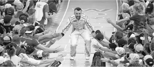  ?? PHOTOS BY SARAH CRABILL/GETTY IMAGES ?? Austin Dillon, who won the season-opening Daytona 500 in spectacula­r fashion in February, fired up the fans prior to Saturday night’s Coke Zero Sugar 400 at Daytona.