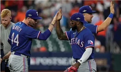  ?? ?? The Texas Rangers celebrate after Game 6 of the AL Championsh­ip Series against the Houston Astros. Photograph: David J Phillip/AP