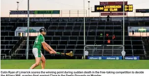 ??  ?? Colin Ryan of Limerick scores the winning point during sudden death in the free-taking competitio­n to decide the Allianz NHL quarter-final against Clare in the Gaelic Grounds on Monday