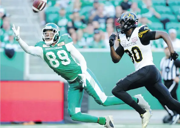  ?? MARK TAYLOR ?? Duron Carter, a converted receiver, nearly comes up with an intercepti­on in the Roughrider­s’ July 5 game against the Hamilton Tiger-cats.