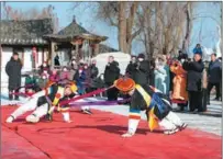  ?? ZHANG BIAO / FOR CHINA DAILY ?? Villagers perform a traditiona­l Korean dance for visitors during a folk festival in Bailong on Jan 5.