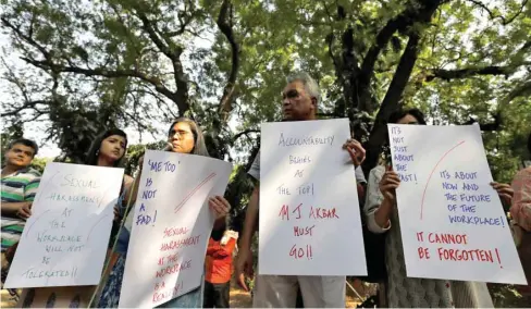  ??  ?? Journalist­s hold placards during a protest against what they say is sexual harassment in the workplace, in New Delhi yesterday.