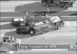  ?? AP/KCBS-TV ?? A still frame from video taken Monday shows a Tesla Model S electric car that crashed into a fire engine on Interstate 405 in Culver City, Calif.