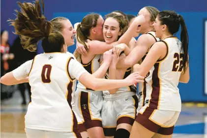  ?? JESSICA HILL/SPECIAL TO THE COURANT ?? Sheehan celebrates its win over Berlin in a class MM semifinal game at Plainville High School on Saturday.