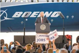  ?? SEAN RAYFORD/GETTY IMAGES ?? President Donald Trump struck positive themes while addressing a crowd Friday during the event for the Dreamliner 787-10 at Boeing’s South Carolina facilities in North Charleston.