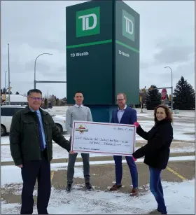  ?? SUBMITTED PHOTO ?? TD Wealth’s Neil Mardian, Marc Sorensen and Matt Solberg present food bank executive director Celina Symmonds with a $15,000 donation.