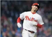  ?? MICHAEL PEREZ — THE ASSOCIATED PRESS ?? Philadelph­ia Phillies pitcher Vince Velasquez smiles after hitting a single during the fourth inning of Saturday’s game against the Miami Marlins.