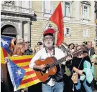  ??  ?? DIFFERENT TUNE Catalan independen­ce supporters celebrate ‘victory’ in Barcelona