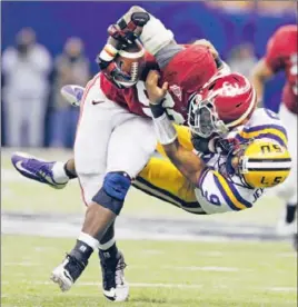  ?? Dave Martin
Associated Press ?? LSU QUARTERBAC­K Jordan Jefferson didn’t do much in the BCS title game, but he did tackle Alabama’s C.J. Mosley . . . after having a pass intercepte­d.