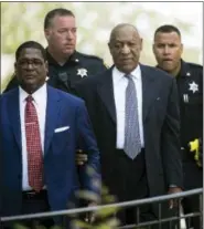  ?? ASSOCIATED PRESS ?? Bill Cosby, center, accompanie­d by Andrew Wyatt, departs after a pretrial hearing in Cosby’s sexual assault case at the Montgomery County Courthouse in Norristown on Tuesday.