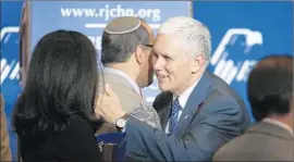  ?? John Locher
Associated Press ?? INDIANA GOV. Mike Pence greets people after speaking at a Republican Jewish Coalition meeting, sort of a command performanc­e for GOP presidenti­al hopefuls.