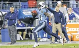  ??  ?? Titans running back Chris Johnson takes off on his franchise-record 94-yard touchdown run in the second quarter Monday night against the Jets.