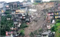  ?? FOTO: MARIA LUISA GARCIA/AP ?? Nästan 60 hus ska ha skadats i skredet i staden Manizales.