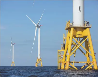  ?? AP FILE PHOTOS ?? CHANGE IN THE AIR: Three wind turbines from the Deepwater Wind project stand in the Atlantic Ocean off Block Island, R.I. Danish offshore wind company Orsted is acquiring the Providence-based Deepwater.