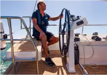  ??  ?? LEFT: The aft seats will comfortabl­y accommodat­e two. Sail controls are led to clutches and winches within easy reach of the helm stations