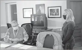  ?? Olivia Morley ?? U.S. Rep.-elect Marjorie Taylor Greene (right) talks to Floyd County Elections Board Chair Tom Rees before he swore her in as a ballot monitor for the presidenti­al race recount Tuesday.