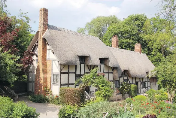  ?? CAMERON HEWITT ?? The thatched roof of Anne Hathaway’s Cottage, a mile outside the town of Shottery, where Shakespear­e’s wife grew up, seems to drip over the 500-year-old building.