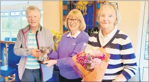  ?? ?? L-r: Mary Kenrick, winner of the Nancy Doyle Trophy accepting her trophy from Margaret Costello, convenor of the senior ladies, along with Yvonne Morrison, who took third place in the competitio­n.