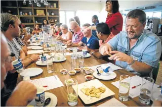  ??  ?? NO SWEAT: The judging panel tucks in to choose the Best Tasting Chilli Sauce
ZaXXX HOT SAUCE I make it in bulk without precise measuremen­ts. Adjust these for a smaller quantity. Take care when handling habaneros.