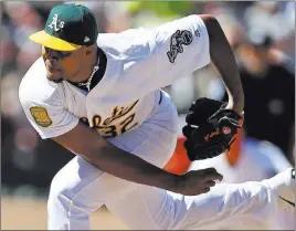  ?? Ben Margot ?? The Associated Press Reliever Jeurys Familia follows through on a ninth-inning pitch in his Athletics debut Sunday against the Giants. He worked two shutout innings in Oakland’s 6-5 win.
