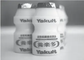  ?? NELSON CHING / BLOOMBERG NEWS FILES ?? Dressed in its familiar red foil, yakult is a popular probiotic Korean milk drink.