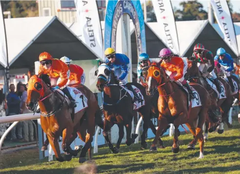  ?? Picture: BRENDAN RADKE ?? BONUS TRIUMPH: Jockey Robert Thompson rides The Harrovian to victory at the Cairns Amateurs Cup.