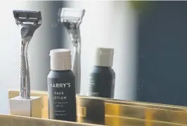  ??  ?? A Winston razor and Harry’s face lotion are on display at the company’s headquarte­rs in New York.