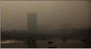  ?? RAFIQ MAQBOOL — THE ASSOCIATED PRESS ?? Morning smog envelops the skyline in Mumbai, India, Friday, Oct. 20, 2017. Environmen­tal pollutants are killing at least 9 million people and costing the world $4.6 trillion a year, a toll exceeding that of wars, smoking, hunger or natural disasters....