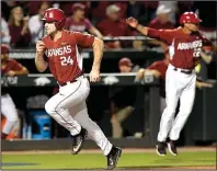  ?? AP/MICHAEL WOODS ?? Arkansas outfielder Chad Spanberger heads home in the first inning of Sunday night’s late game against Missouri State in the Fayettevil­le Regional final. The Razorbacks led 6-3 in the top of the fourth inning when the game was delayed because of rain....
