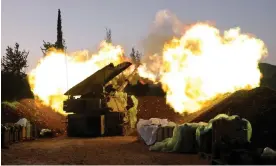  ?? Photograph: Jalaa Marey/AFP/Getty Images ?? An Israeli artillery unit fires from a position in Upper Galilee in northern Israel towards southern Lebanon, on 11 December.