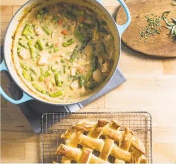  ?? Carl Tremblay / Associated Press ?? Chicken Pot Pie is possible with just a Dutch oven. Here, leeks are traded for asparagus.