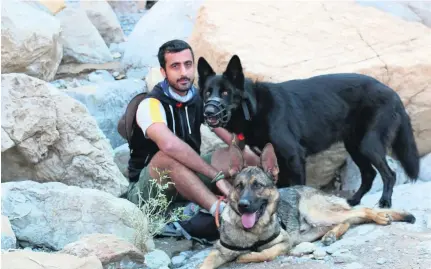  ?? Courtesy Hussain Darwish ?? Animal activist Hussain Darwish is determined to change the lives of dogs and people with his mountain walkies.