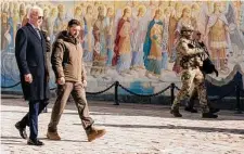  ?? Daniel Berehulak/New York Times ?? President Joe Biden, left, is escorted by President Volodymyr Zelenskyy of Ukraine in the capital of Kyiv early Monday.