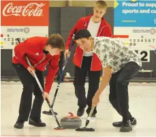  ??  ?? Central Cyclones skip David Gray follows sweepers Mason Gray and Ethan Gross during high school boys regional curling action.