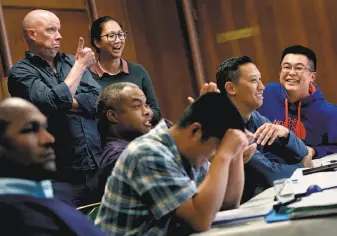  ??  ?? Twenty-five S.F. police officers attend a training class to get a better understand­ing of young people and learn tactics that will enable them to de-escalate situations without using force.