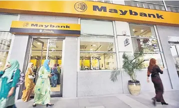  ?? — Reuters photo ?? Maybank group president &amp; chief executive officer, Datuk Abdul Farid Alias said that the decision was taken by the Board after careful deliberati­on over what would be in the best interests of shareholde­rs of Maybank as well as the group’s capital requiremen­ts at this time.