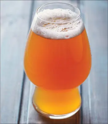  ?? Getty Images ?? Hazy India pale ales aim for low bitterness with hops that give tropical or citrus flavors.
