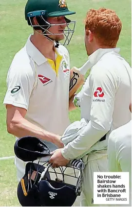  ?? GETTY IMAGES ?? No trouble: Bairstow shakes hands with Bancroft in Brisbane