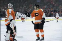  ?? MATT SLOCUM - THE ASSOCIATED PRESS ?? The Flyers’ Nicolas Aube-Kubel, right, and Carter Hart celebrate after a goal by Aube-Kubel during the third period Thursday. Both were on their games early and often in a 4-1 win over Carolina.