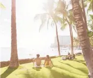  ?? MICHELLE MISHINA-KUNZ/THE NEW YORK TIMES ?? Socially distanced beachgoers in the Waikiki area of Honolulu, Hawaii.